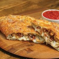 Chicken Classico Calzone · Stuffed with grilled chicken, bacon, onions and our signatures 3 cheeses, served with a side...