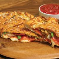 Deluxe Calzone · Our handmade dough stuffed with pepperoni, italian sausage, mushrooms, green peppers, onions...