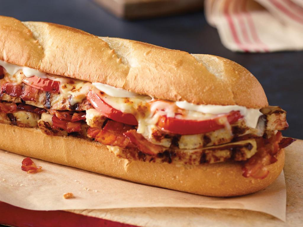 Chicken Club Sub · Grilled chicken, bacon, tomatoes, mayo, and our signature three cheeses.
