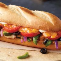 Veggie Sub · Mushrooms, green peppers, onions, black olives, tomatoes, cheddar cheese, and sub dressing.