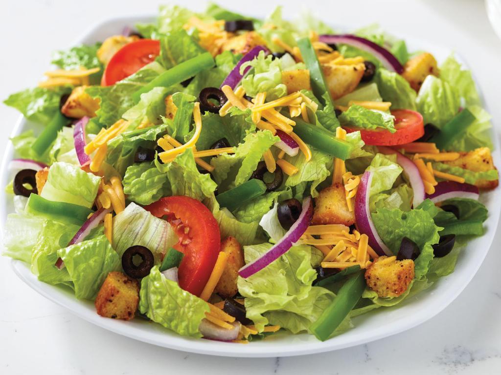 Garden Salad · Lettuce with cheddar, black olives, red onions, green peppers, sliced tomatoes, and croutons. Served with ranch dressing.