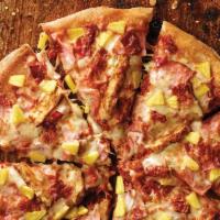 Hawaiian Chicken Pizza · Ham, grilled chicken, bacon, pineapple, sauce and three cheese blend.
