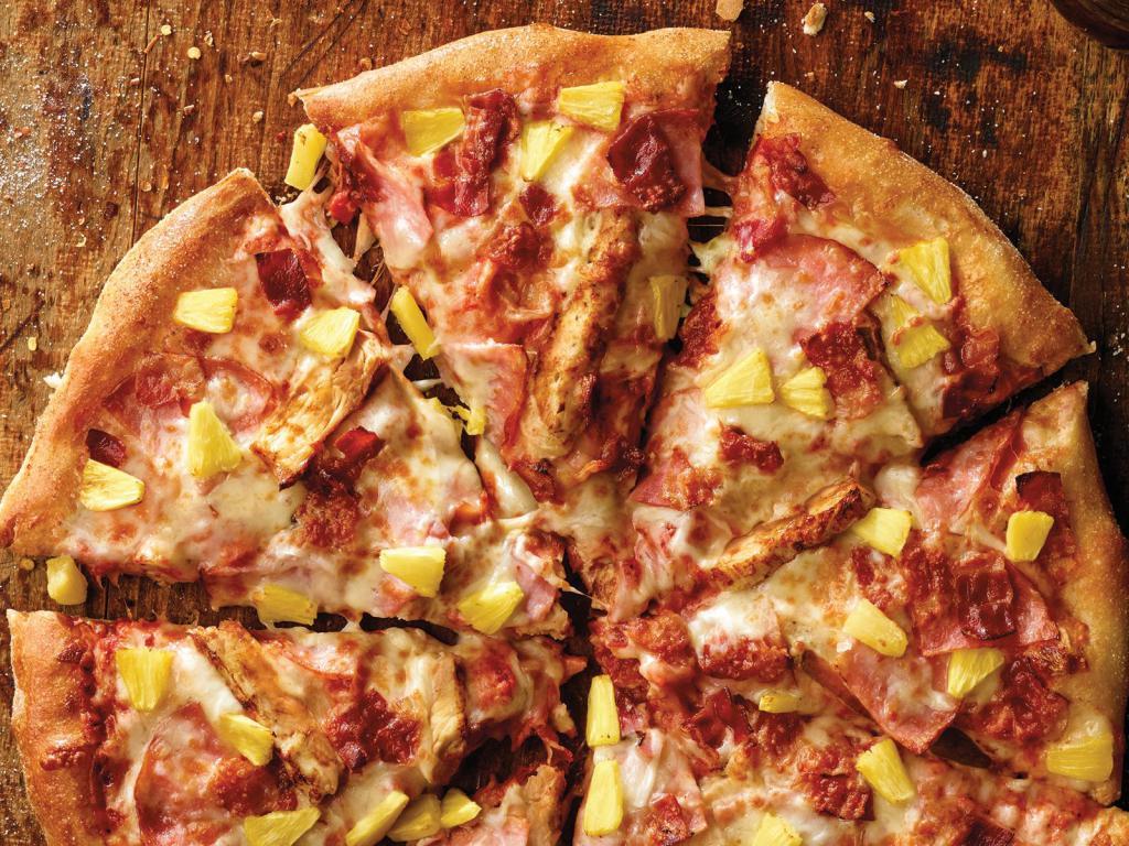 Large Hawaiian Chicken Pizza · 8 slices. Ham, grilled chicken, bacon, pineapple, our signature sauce and 3-cheese blend.