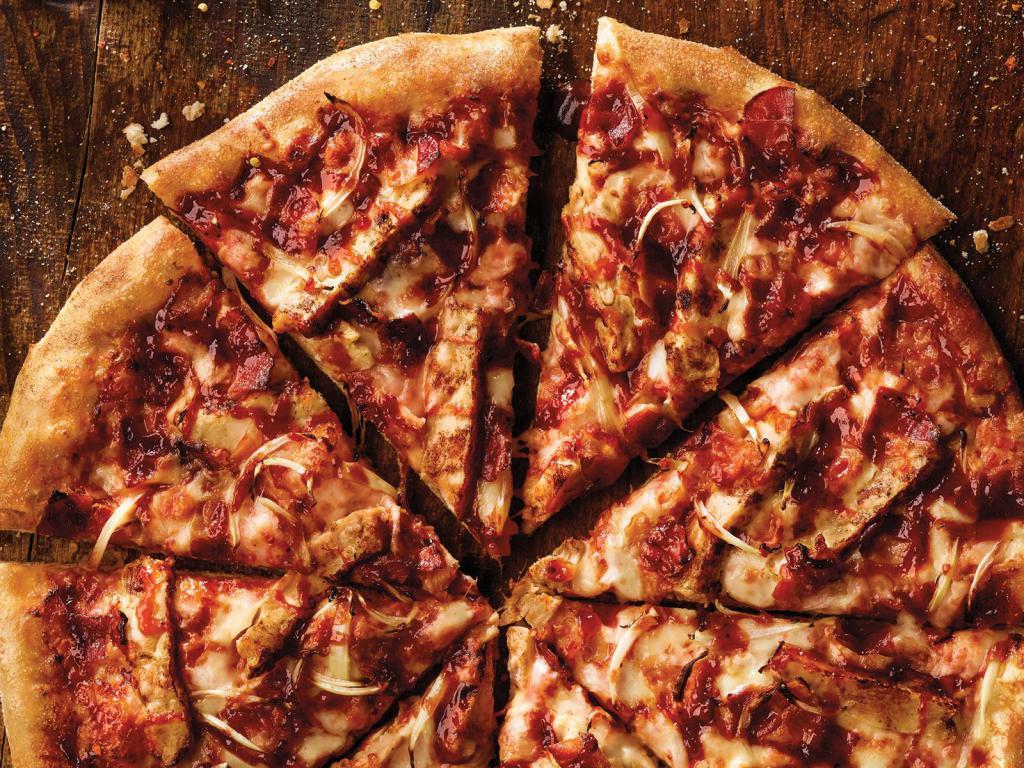 BBQ Chicken Pizza · Grilled chicken, bacon, onions and our three cheese blend, topped with tangy BBQ sauce.