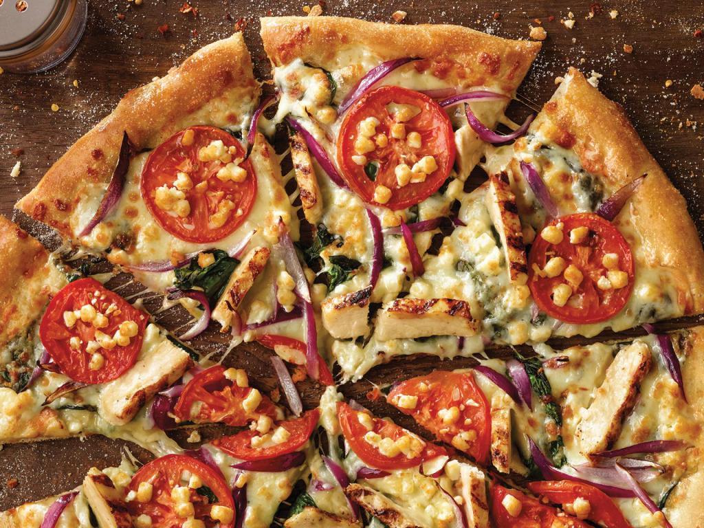 Chicken Florentine Pizza · White sauce, spinach, chicken, red onion, tomatoes and feta cheese.