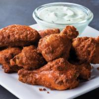 10 Piece Chicken Wings · Classic chicken wings served hot or tangy BBQ style with your choice of dipping sauce.