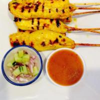11. Chicken Sate · 6 pieces. Marinated grilled chicken on a stick served with peanut sauce and cucumber salad.