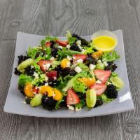 Sunrise Salad · Orange slice, grapes, seasonal berries and feta cheese served over spring mix.