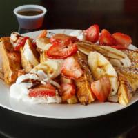 French Toast Special Breakfast · Banana, walnuts served over extra thick French toast with cinnamon, sugar and whipped cream.