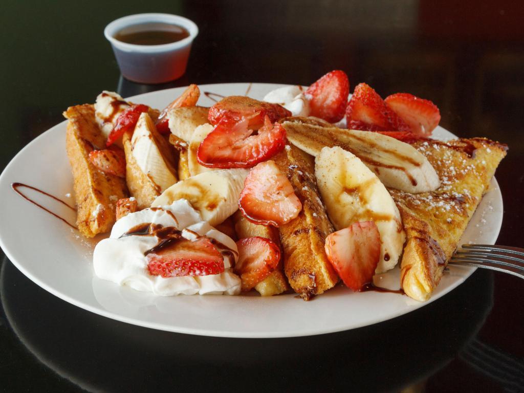 French Toast Special Breakfast · Banana, walnuts served over extra thick French toast with cinnamon, sugar and whipped cream.