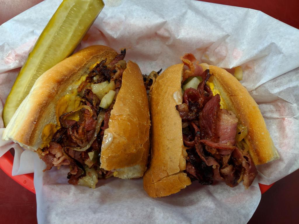Pastrami Hot Sandwich · Pastrami, onions, pickles, mustard and cheese.