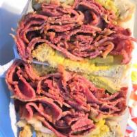 Jim's Famous Extra Large Hot Pastrami on Rye Mustard Pickles & Onion · Jims Famous Extra Large Hot Pastrami Heaped on Rye bread with Mustard Pickles & Onion