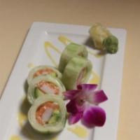 Naruto · Salmon, avocado and crab stick rolled with thinly cucumber wrap serve with mango sauce.