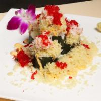 Super Volcano Maki · Salmon, avocado, topped with red crab stick tobiko, tempura crumb scallion, sever with spicy...