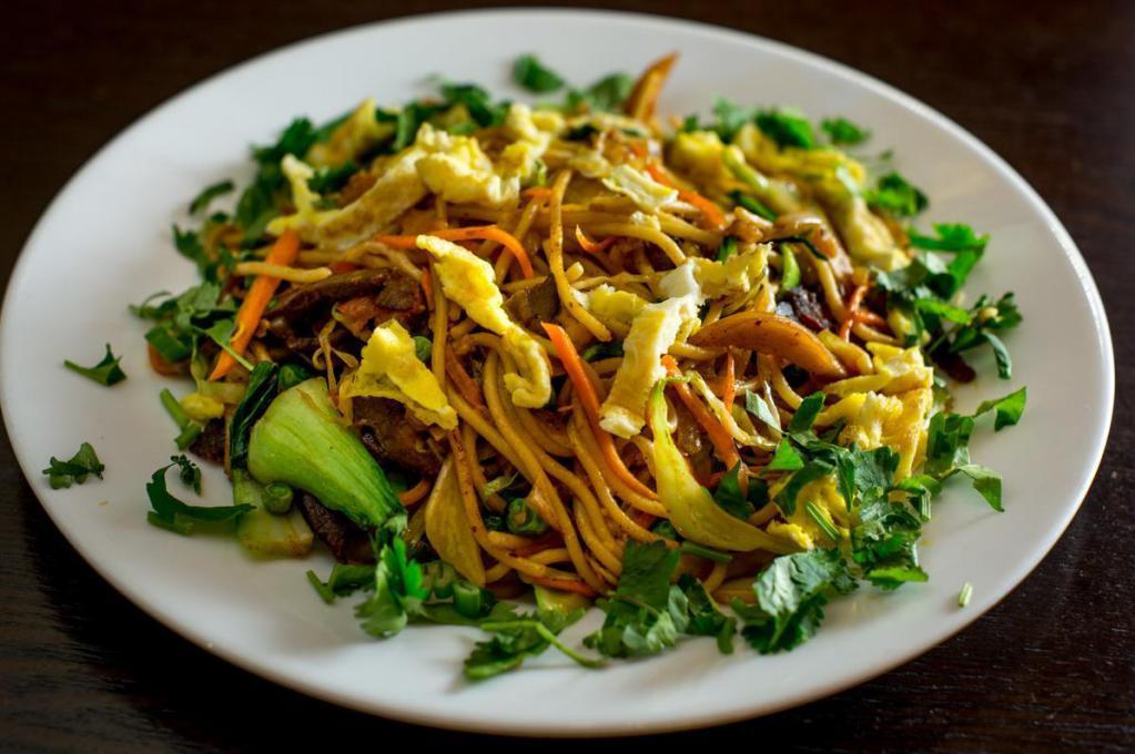 Chow Mein · Noodles sauteed with choice of protein, mixed with cabbage, bok choy, green peas and carrots and sprinkled with scallion and cilantro.