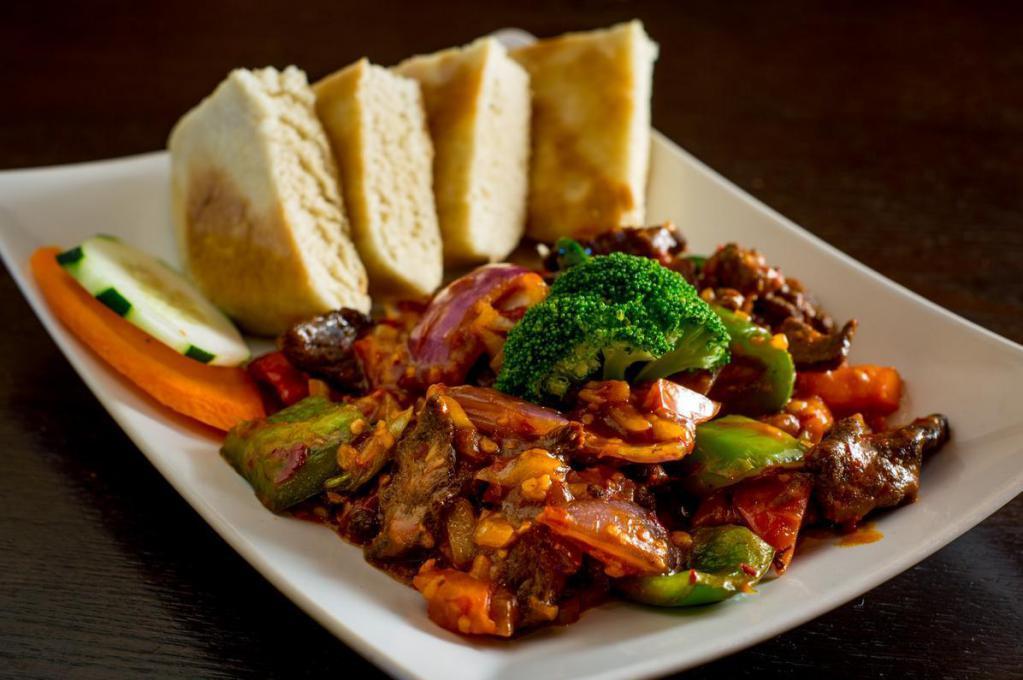Shapta Beef · Sliced beef stir-fried with garlic, ginger, red onion, green and red bell peppers. Served with choice of side.