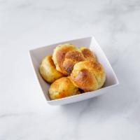 Garlic Knots · 6 pieces. A classic snack, our garlic knots are strips of pizza dough tied in a knot, baked,...