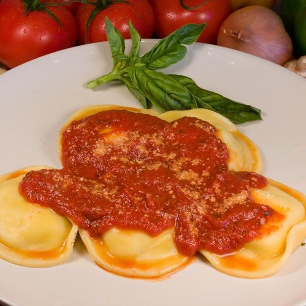 Ravioli · Ravioli stuffed with meat or cheese with marinara sauce and oven baked with mozzarella.