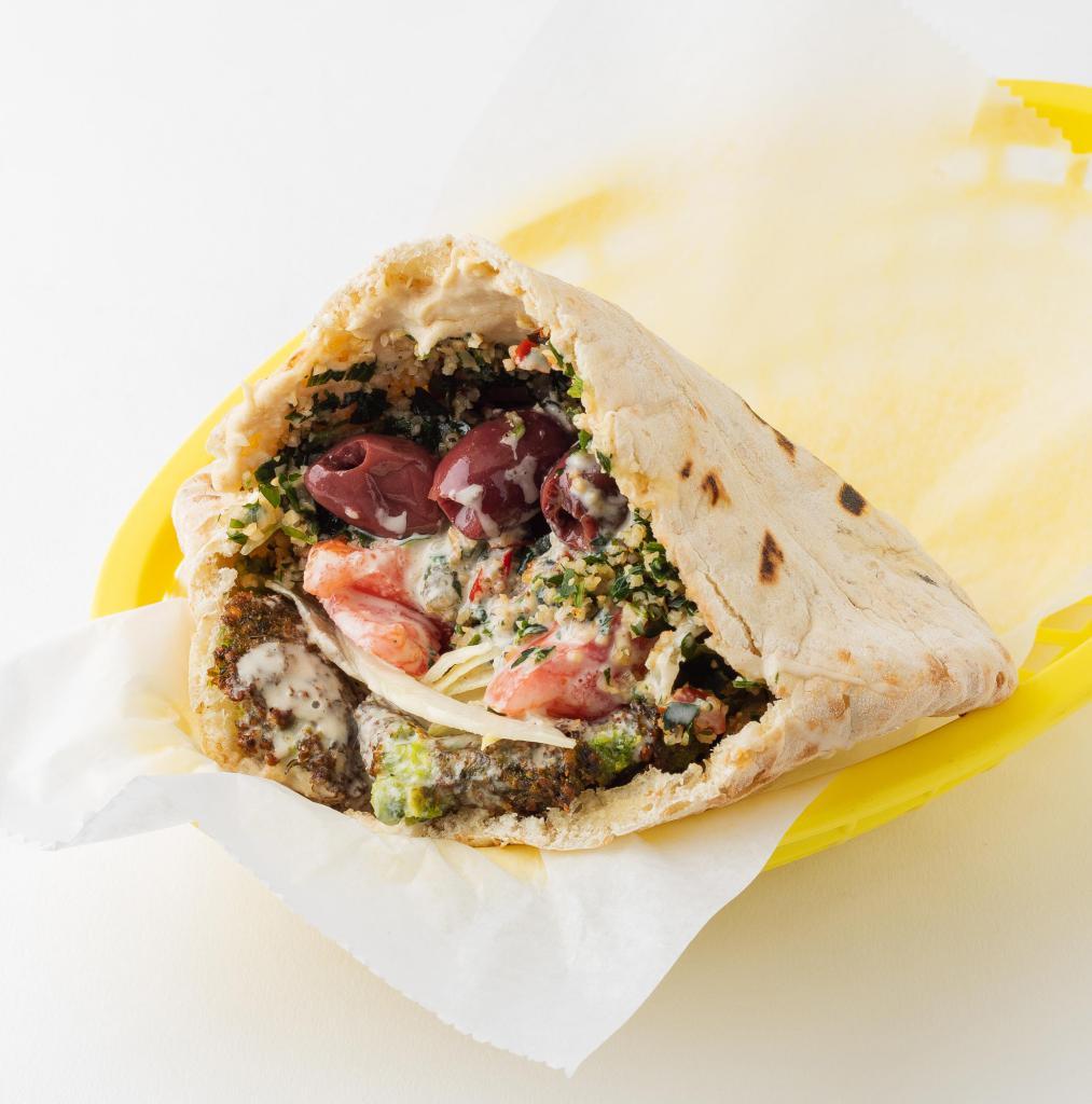 East Village Sandwich (vegetarian) · Falafel, Hummus, and Tabbouleh served: served in a pita pocket with lettuce, tomatoes, onions, olives, and tahineh sauce