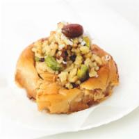 Mabrumeh · Twisted fillo dough topped with mixed nuts (walnuts, almonds and pistachios) and coconut fla...