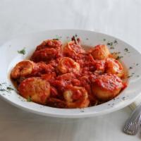 Capellini Pescatore · Shrimp and scallops sauteed delicately in a garlic and tomato sauce served with angel hair p...