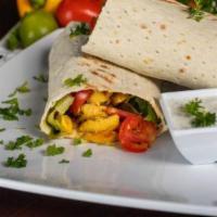 Chicken Shawarma Wrap · Tender slices of chicken and marinated then grilled.
