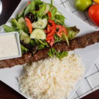 Kufta Kabob · Ground beef, mixed with onions, formed around a kabob skewer and grilled. Served with rice, ...