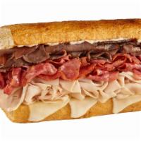 #33 Triple Dip · Hot roast beef, turkey & pastrami, with mayo, provolone & hot au jus
