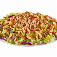 Asian Chicken Salad · Chicken, shredded lettuce, carrots, cabbage, green onions & cilantro with wonton strips, ses...