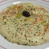 Hummus App · Blended chickpeas, tahini, olive oil, lemon juice, salt, and garlic (served with one pita)