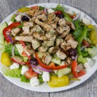 Grecian Chicken Salad · Our Greek salad topped with fresh slices of chicken.