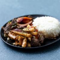 LOMO SALTADO · A delicious and distinctive Peruvian dish consisting of juicy sirloin strips stir-fried with...