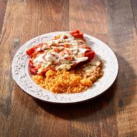Enchiladas Tapatias · 3 soft corn tortillas filled with chicken and covered with guajillo sauce, goat cheese and s...