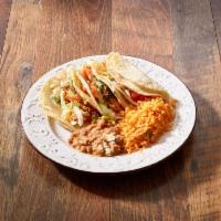 Soft Tacos · 3 soft tacos stuffed with chicken, steak or pork. Topped with onions, cilantro, cheese and l...