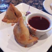  Vegetable Samosa 2 pcs (V) · Puffed pastries stuffed with diced potatoes, green peas and our special spices. Served with ...