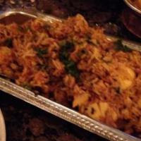 Egg Biryani · Basmati rice pilaf mixed with spices and hard boiled eggs.