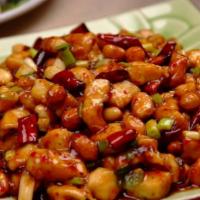 34. Kung Pao Chicken · Chicken, green and red peppers, celery, peanuts, and chili peppers in a brown spicy sauce.  ...