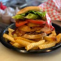 Western Burger · All the goodness of the classic burger with onion rings topped with 2 classic cut bacon and ...