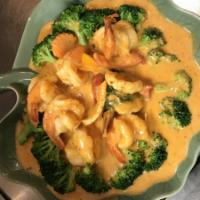 Chu Chee Shrimp · Pan fried shrimp topped with Thai curry sauce and garnish with vegetables.