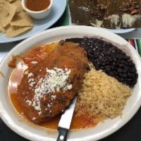 Chile Relleno Plate · Poblano pepper stuffed with panela or Oaxaca cheese. Served with beans, rice.