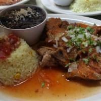 Pork Carnitas Plate · Crispy and tender pork chunks served with ranchero sauce, beans, and rice. handmade tortillas 