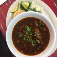 Pozole Rojo · Pork or chicken w hominy. Served with cabbage, radish, onion, cilantro, lime, oregano and tw...