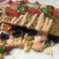 Grilled Fish Burrito · Grilled swai fish, green sauce, pico de gallo, chipotle mayo, rice and black beans all wrapp...