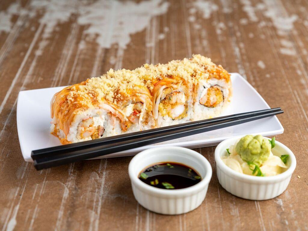 SP27. Batman Roll · Spicy crawfish, cream cheese, shrimp tempura topped with crabstick, spicy mayo, eel sauce and crunchies. Spicy.