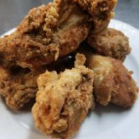 Fried or Smothered Chicken · Three pieces of crispy chicken marinated in dry seasoning or smothered in its own gravy.