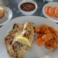 Grilled Tilapia · Grilled with a dash of olive oil and served with a lemon butter sauce.