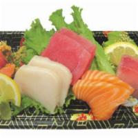 18. Sashimi Deluxe · Tuna, escolar, salmon, hamachi, chopped spicy tuna and avocado.