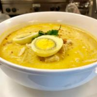 Curry Noodle Soup · Yellow curry in creamy coconut milk broth served with rice noodles, boiled egg, chicken and ...