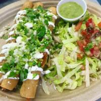 Taquitos · 3 corn tortillas Topped with sour cream, queso fresco, onions and cilantro, served with a si...