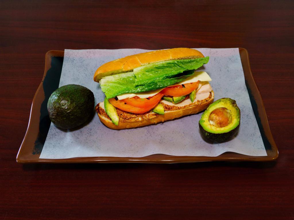 4. Chipotle Turkey and Avocado Sandwich · Oven roasted turkey breast,home made chipotle mayo, American cheese,fresh avocado, tomatoes and lettuce. Served hot or cold.
